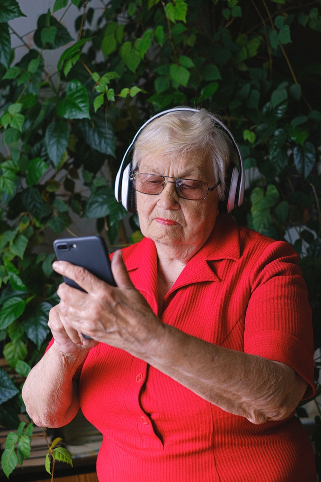 Old Woman Wearing Headphones